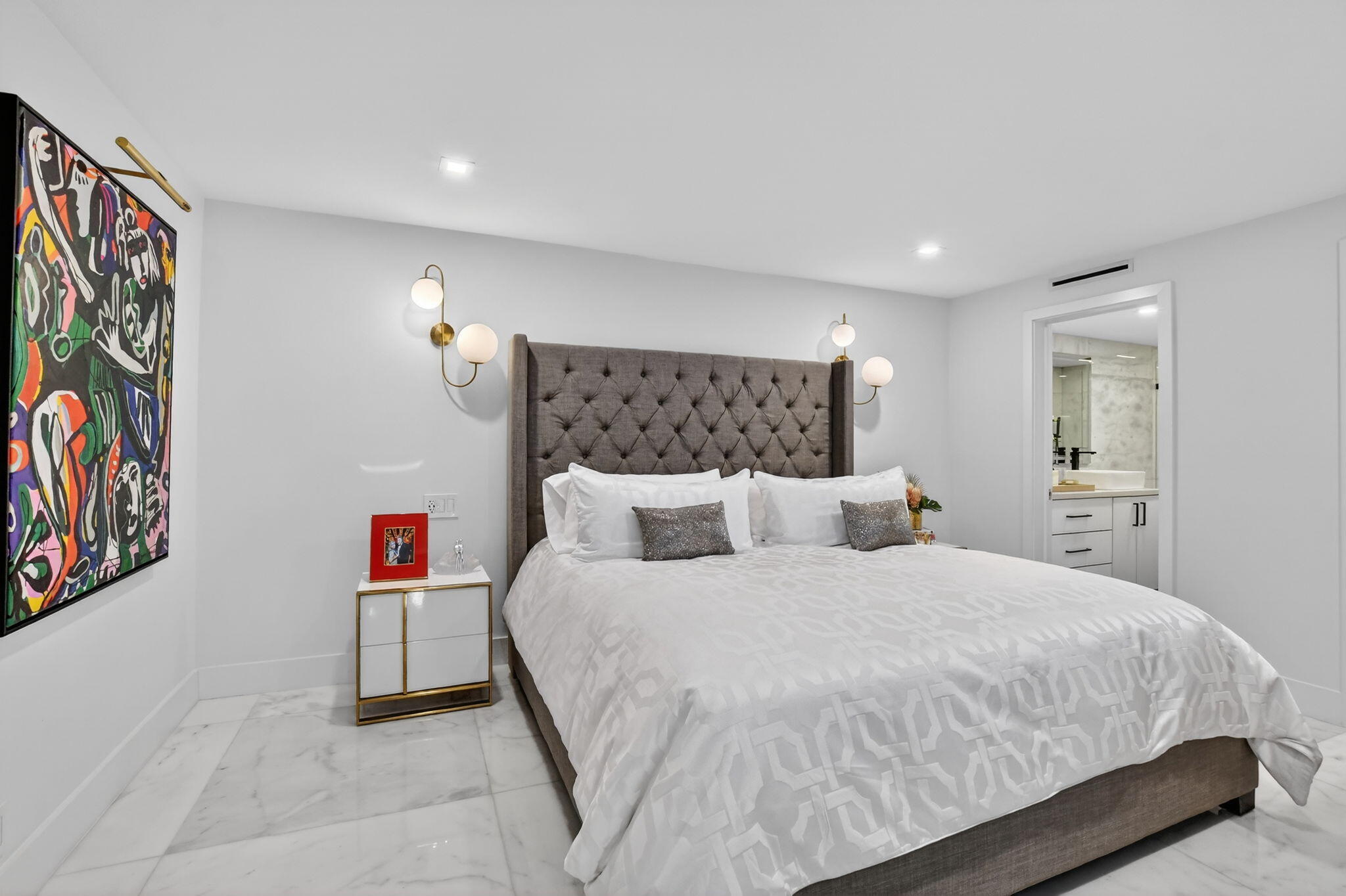 1834 Bridgewood Drive Boca Raton, FL 33434 - Photo 15 of 24 a bedroom with a bed and a painting on the wall