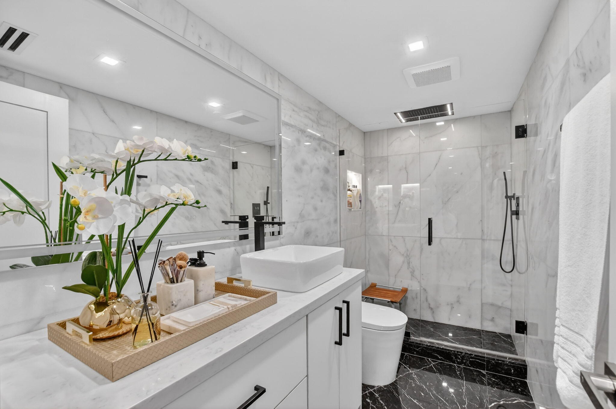 1834 Bridgewood Drive Boca Raton, FL 33434 - Photo 18 of 24 a bathroom with a sink a toilet and shower