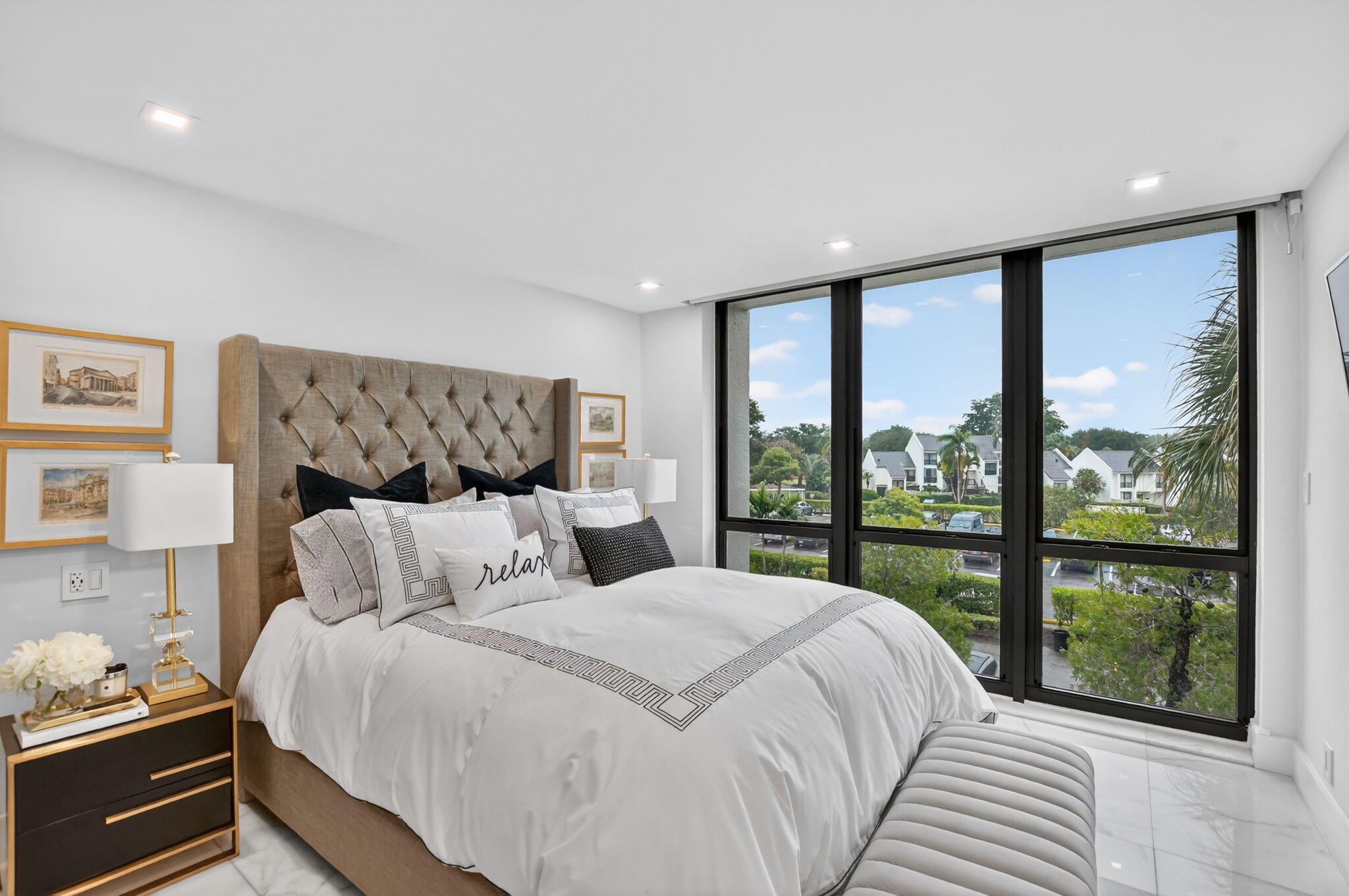 1834 Bridgewood Drive Boca Raton, FL 33434 - Photo 4 of 24 a bedroom with a large bed and a large window