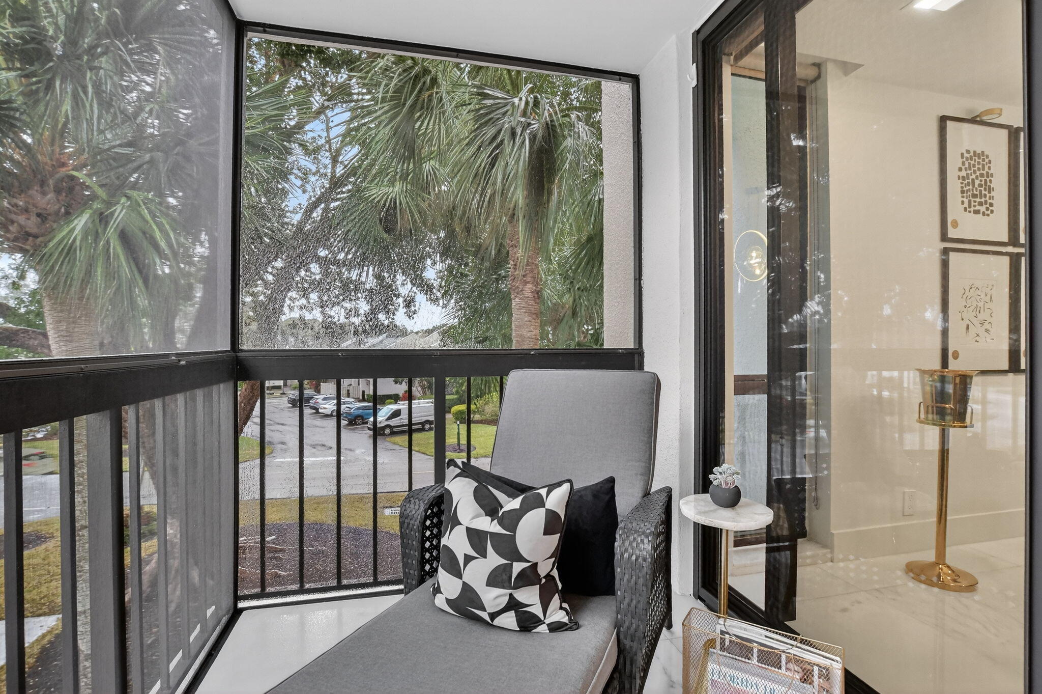 1834 Bridgewood Drive Boca Raton, FL 33434 - Photo 5 of 24 a view of a balcony with chair and front door