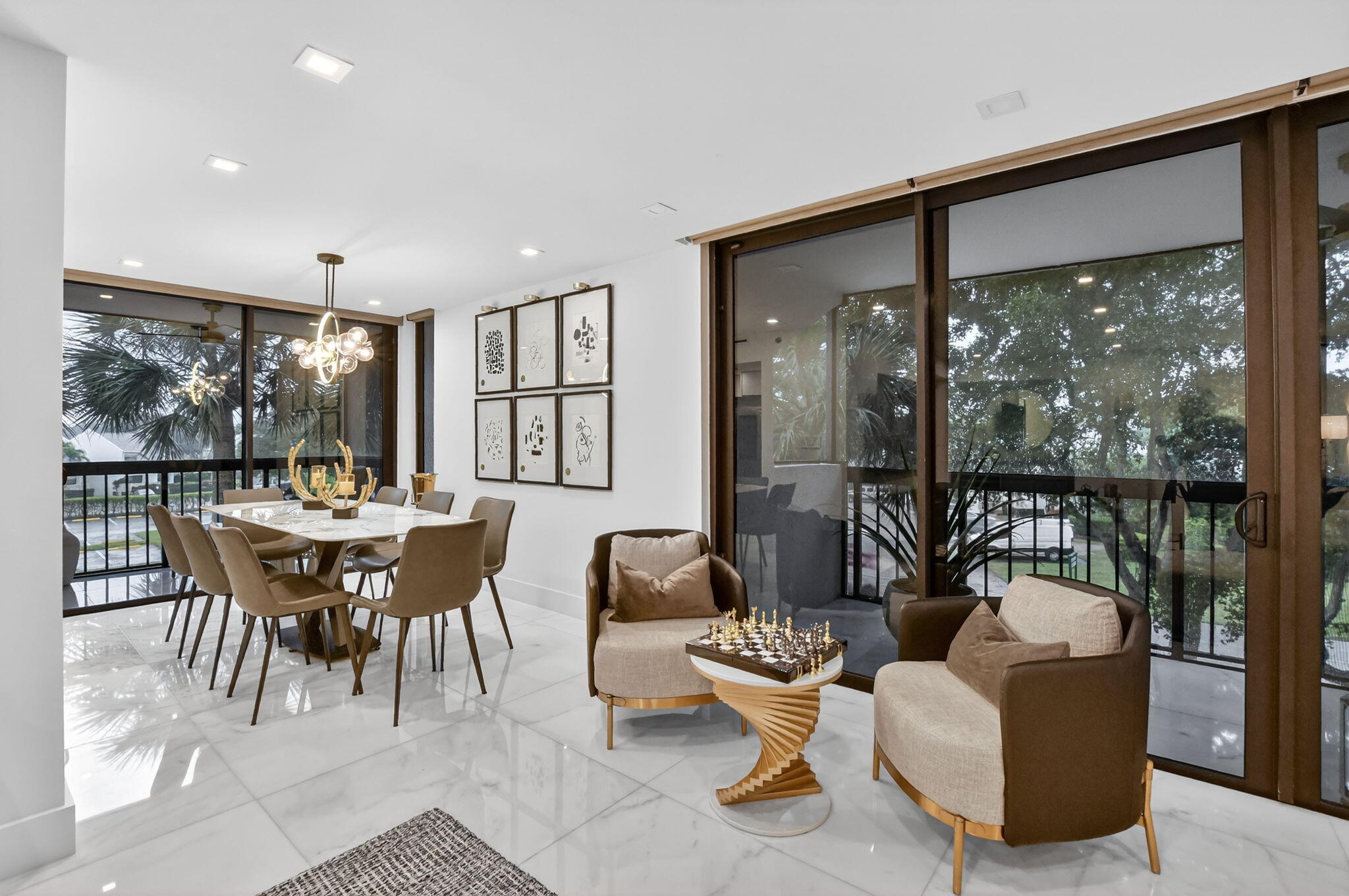1834 Bridgewood Drive Boca Raton, FL 33434 - Photo 10 of 24 a dining room with furniture a rug and a large window