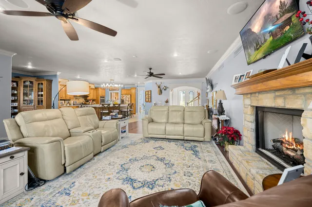 a living room with furniture and a fireplace