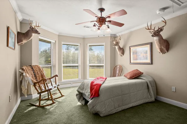 a bathroom with a granite countertop sink a bathtub a mirror and shower
