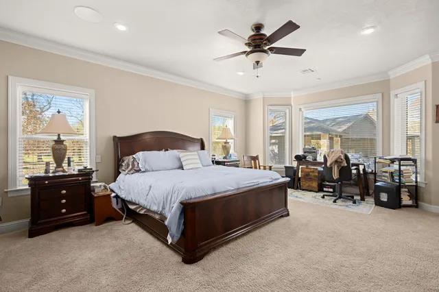a spacious bathroom with a tub sink and mirror
