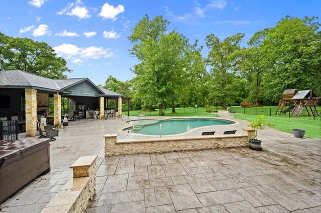 a view of outdoor space yard deck patio and swimming pool