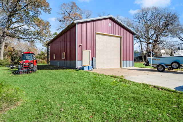 a front view of house with a garden