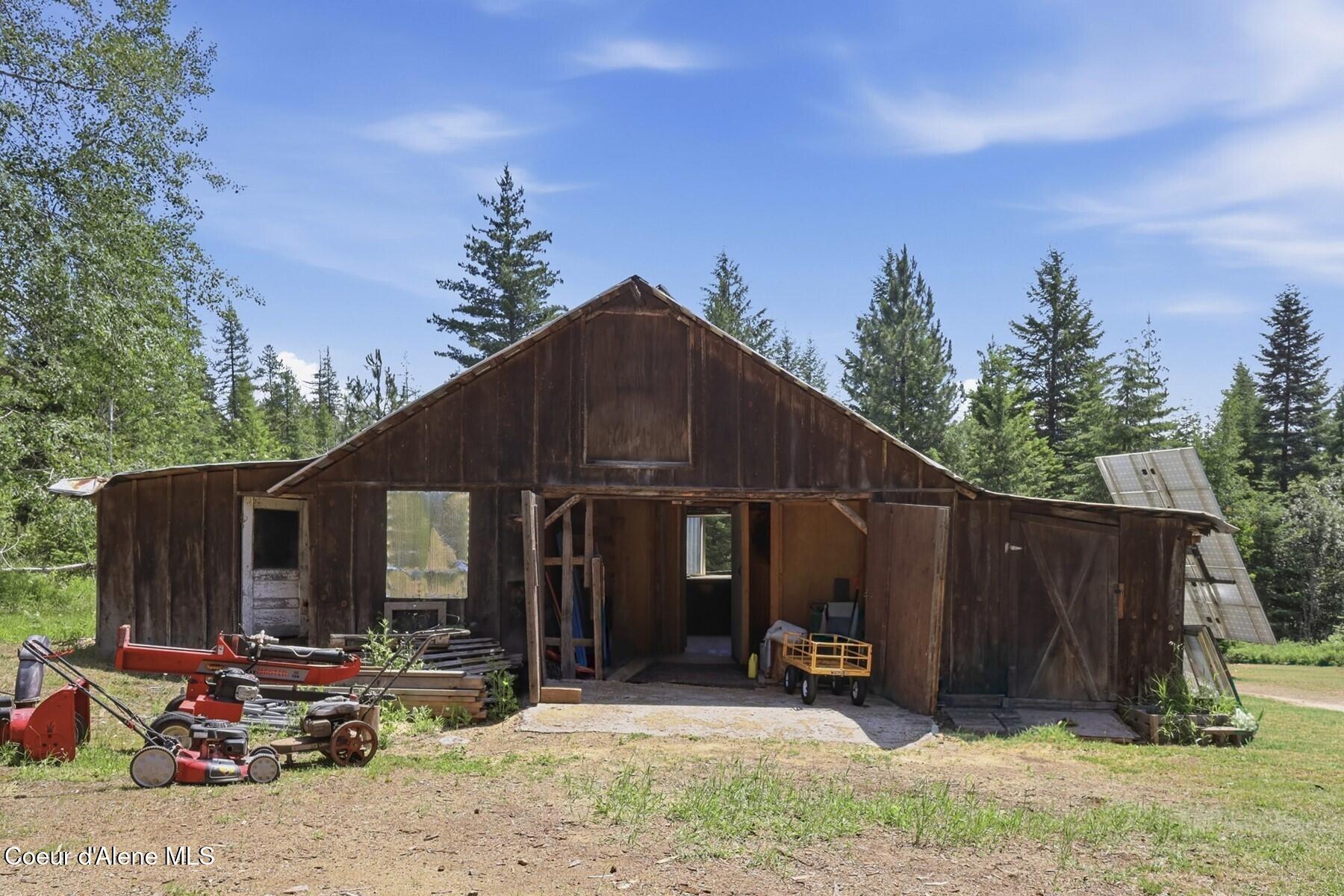 2307 Gold Creek Ridge Road Sandpoint, ID 83864 - Photo 40 of 50 Woodshop and Firewood Storage