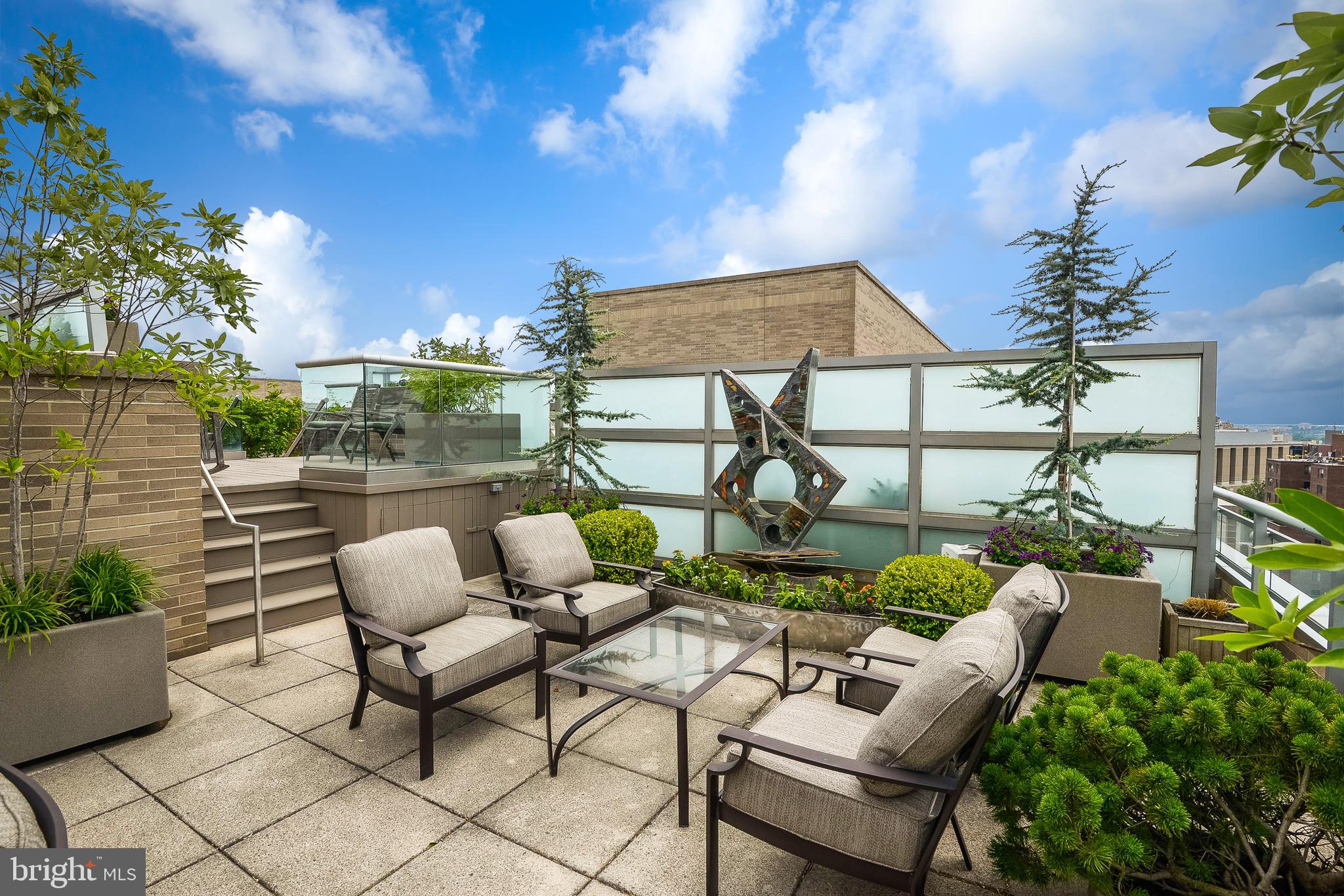 a view of a chairs and table in a patio