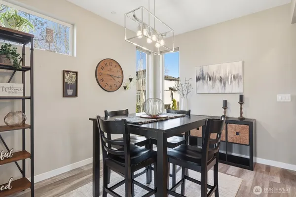 a view of a dining area with furniture and wooden floor