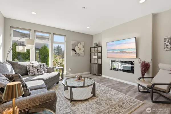 a living room with furniture and a large window