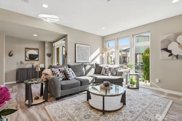 a living room with furniture and a large window