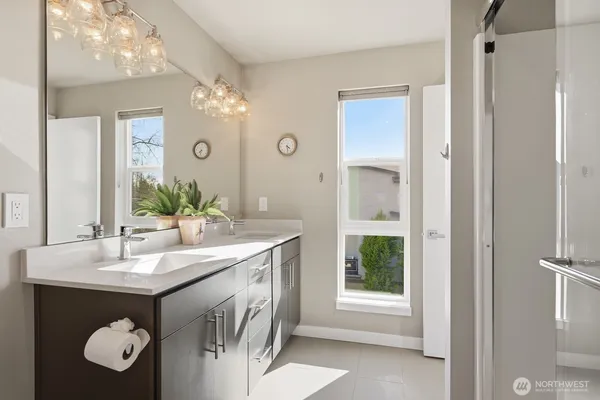 a bathroom with a sink vanity and a mirror
