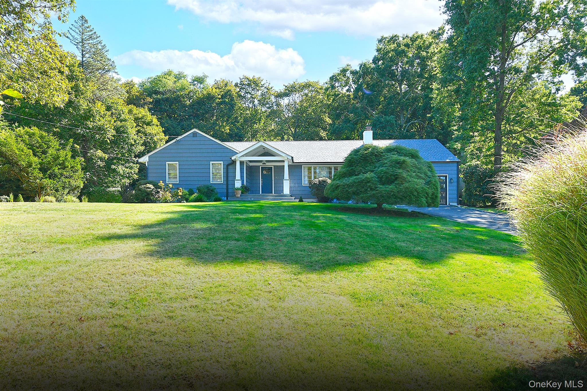 42 Flower Hill Road Huntington, NY 11743 - Photo 1 of 1 Single story home featuring a front yard and a chimney