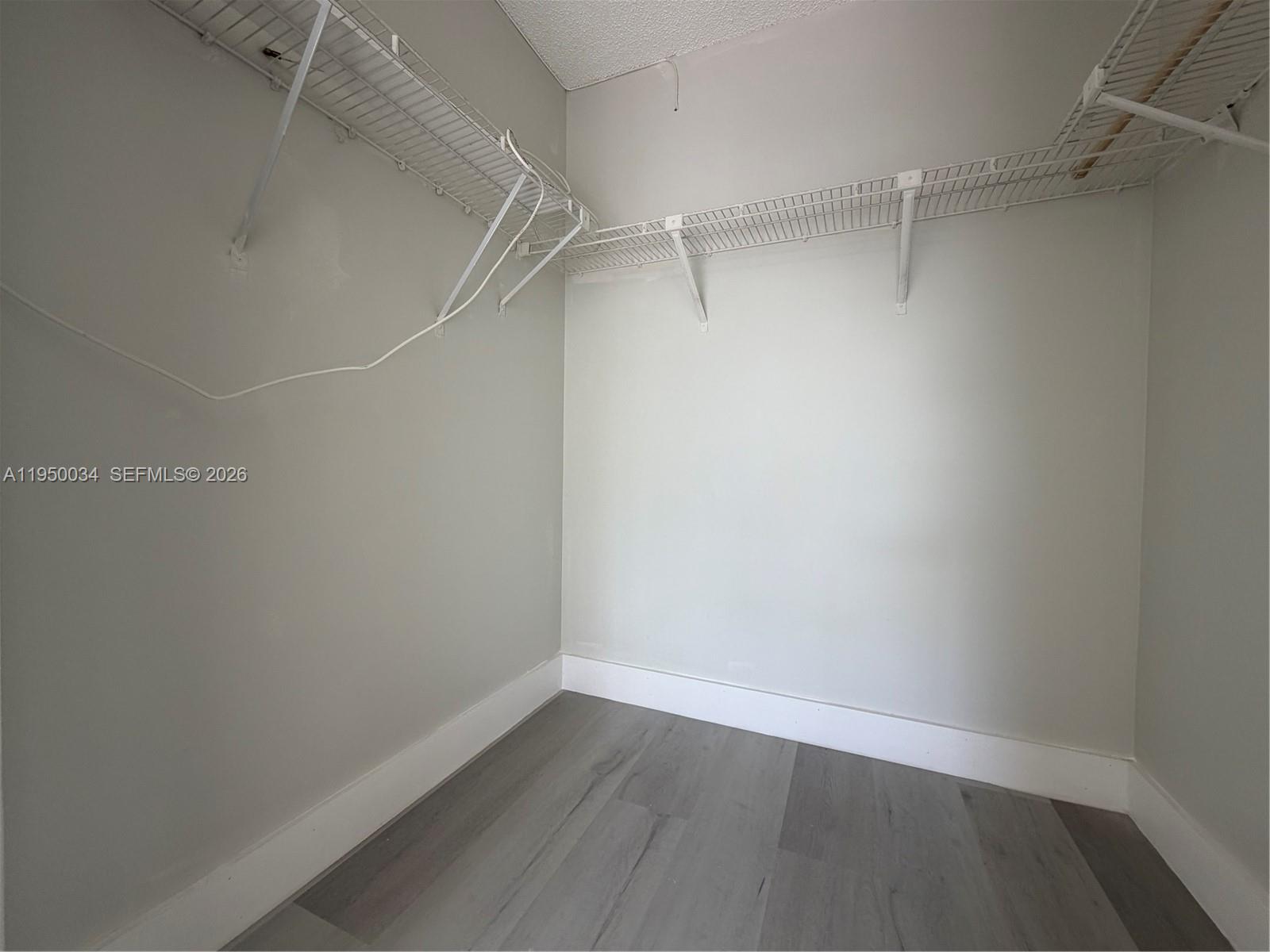 17021 North Bay Road, Unit 216 Sunny Isles Beach, FL 33160 - Photo 22 of 40 a view of an empty walk in closet
