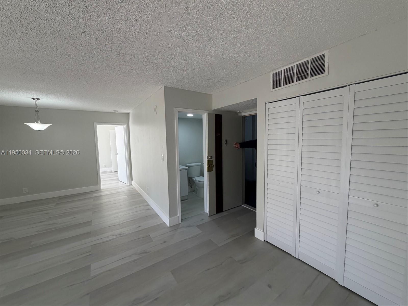 17021 North Bay Road, Unit 216 Sunny Isles Beach, FL 33160 - Photo 8 of 40 a view of a hallway with wooden floor