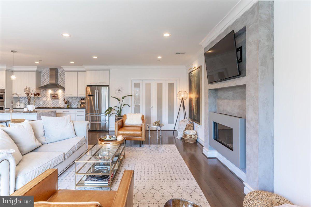 1121 G Street Northeast, Unit 3 Washington, DC 20002 - Photo 11 of 37 Gas fireplace with tv mounted above. Brilliant.