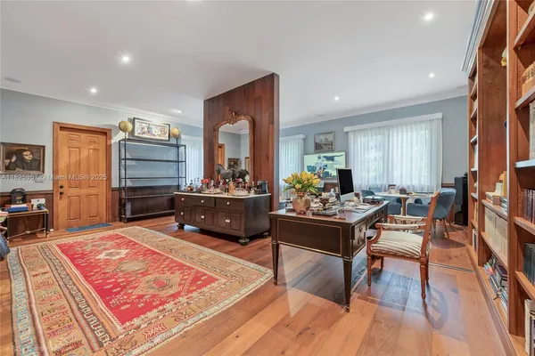 a living room with furniture and a rug