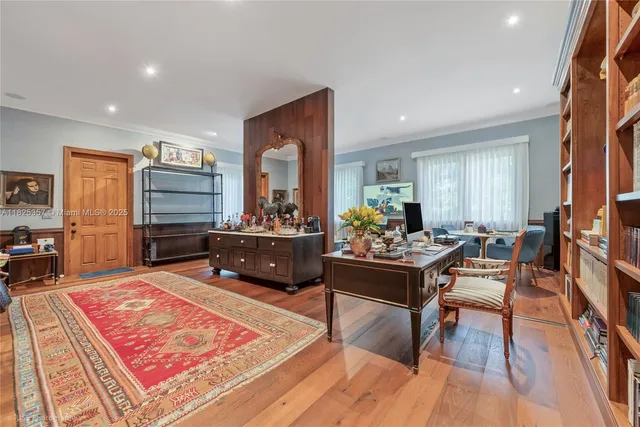 a living room with furniture and a rug