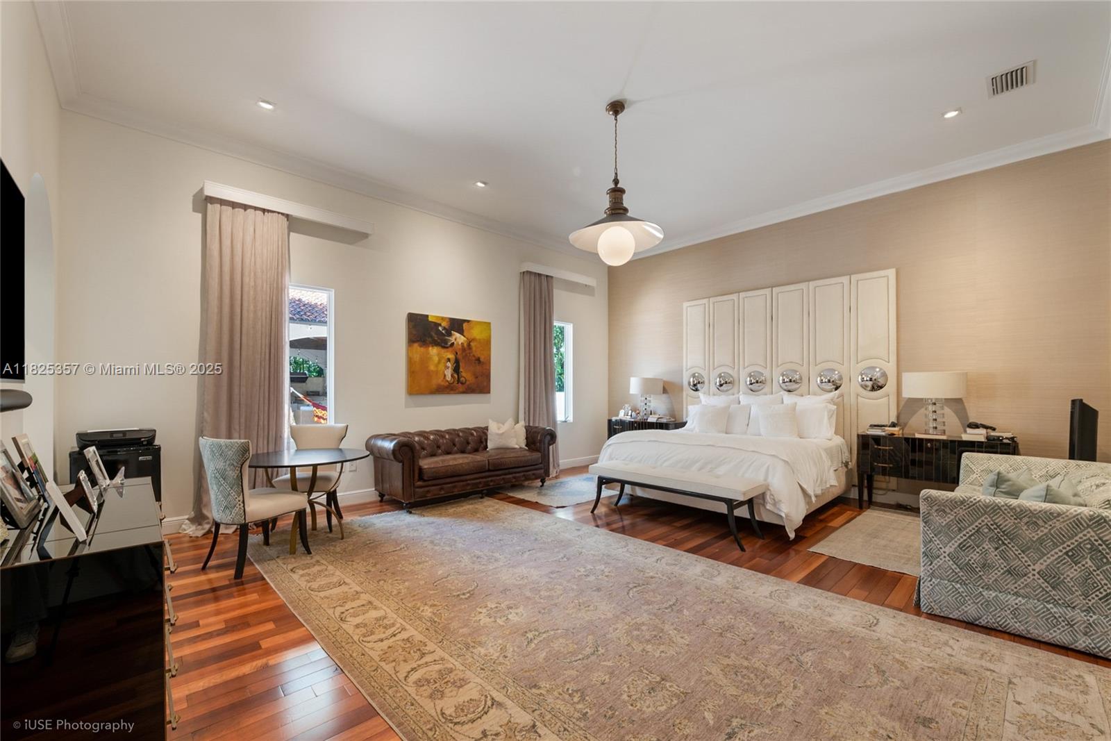 7405 Southwest 104th Street Pinecrest, FL 33156 - Photo 15 of 23 a spacious bedroom with a bed a couch and dresser