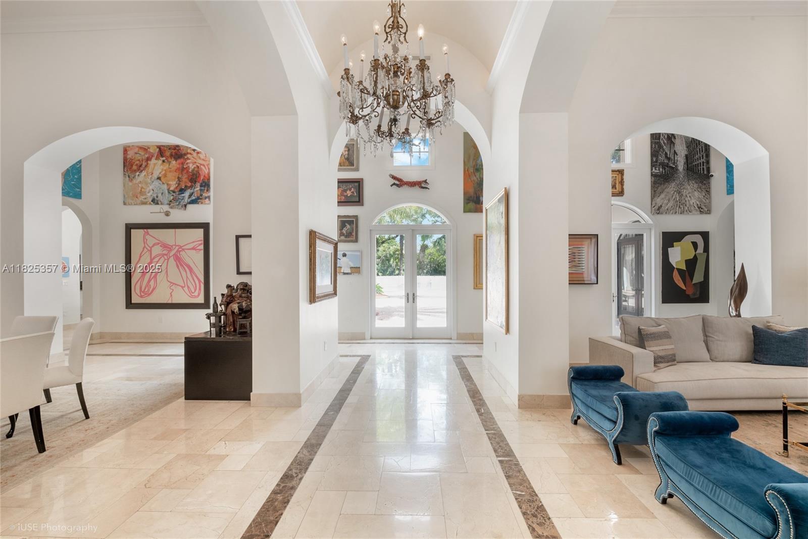 7405 Southwest 104th Street Pinecrest, FL 33156 - Photo 3 of 23 a living room with furniture and a chandelier