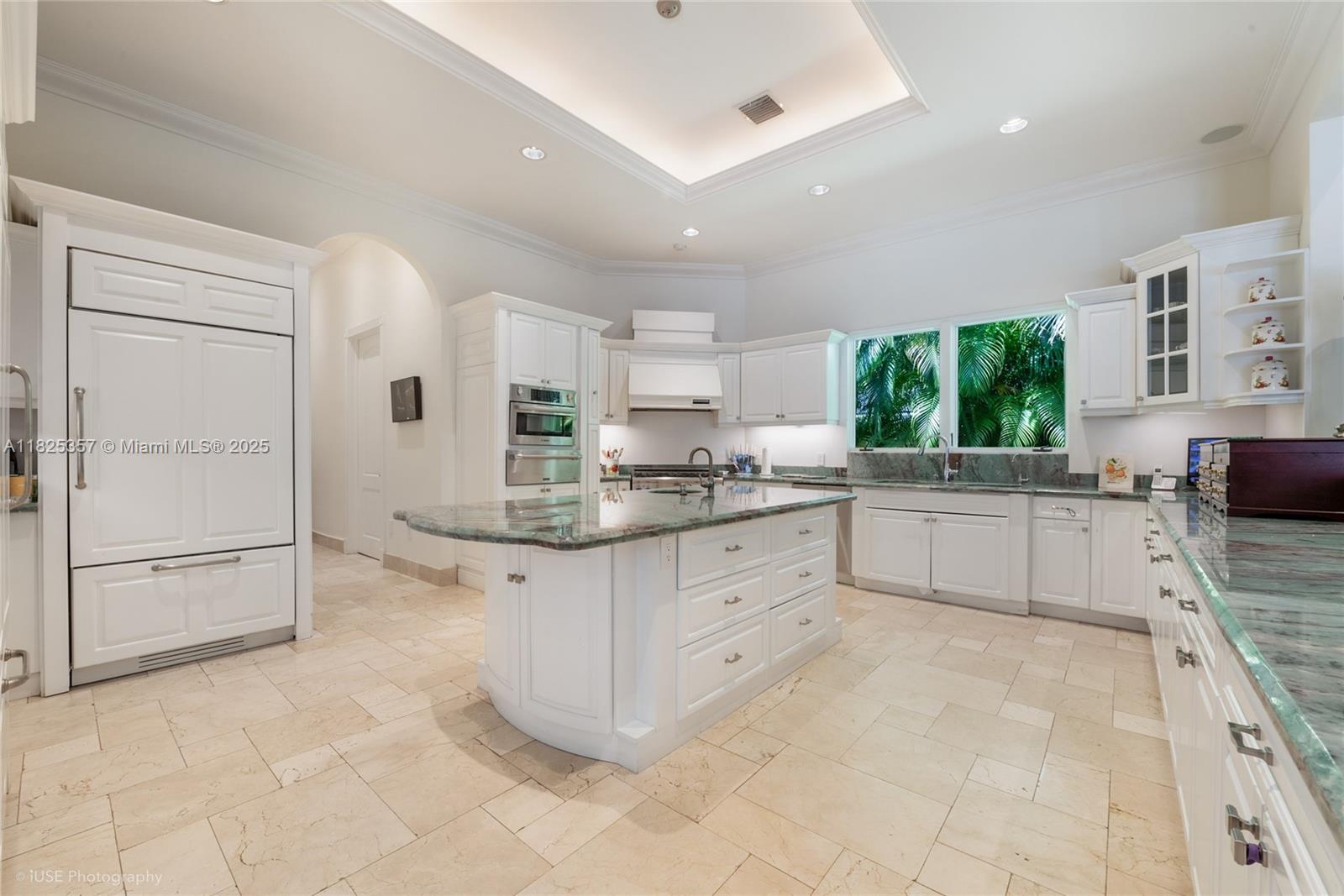 7405 Southwest 104th Street Pinecrest, FL 33156 - Photo 9 of 23 a kitchen with stainless steel appliances a sink cabinets and window