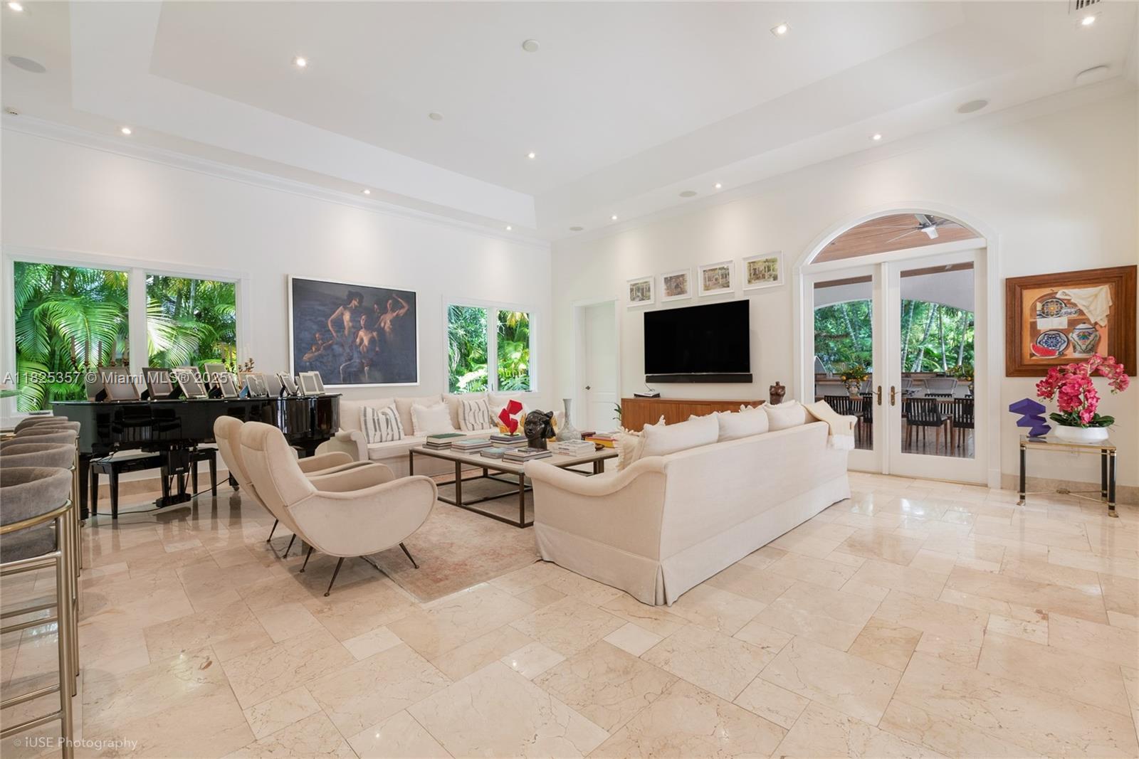 7405 Southwest 104th Street Pinecrest, FL 33156 - Photo 10 of 23 a living room with furniture and a flat screen tv