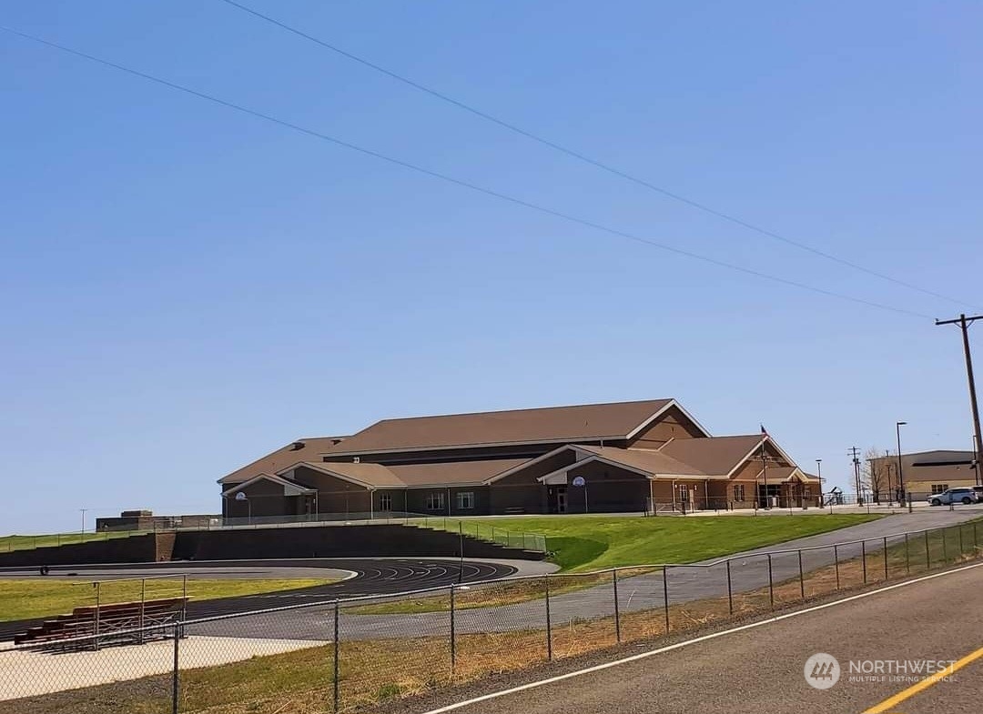 205 Middle Road Bickleton, WA 99322 - Photo 17 of 19 a view of a big house with a big yard and potted plants