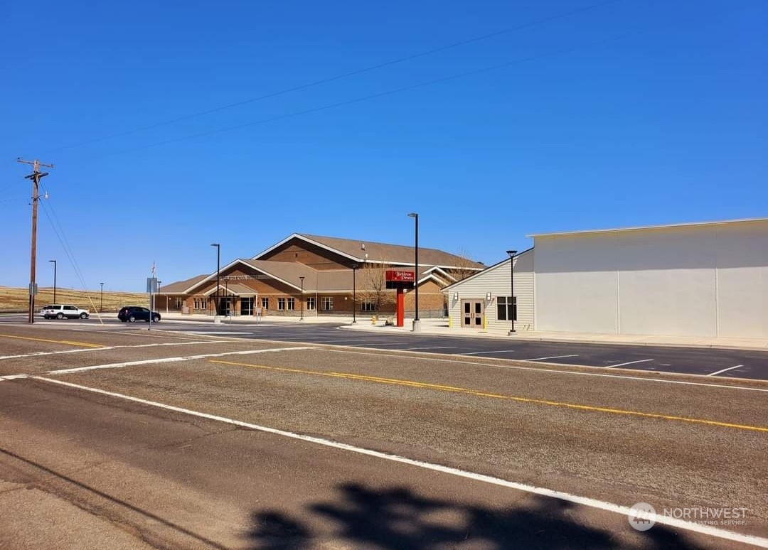 205 Middle Road Bickleton, WA 99322 - Photo 18 of 19 a front view of a house with a yard and garage