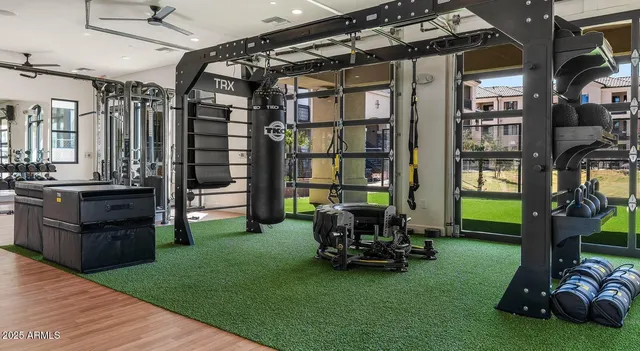a view of a room with lots of gym equipment