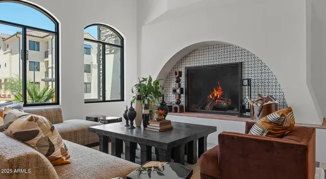 a living room with furniture and a large window