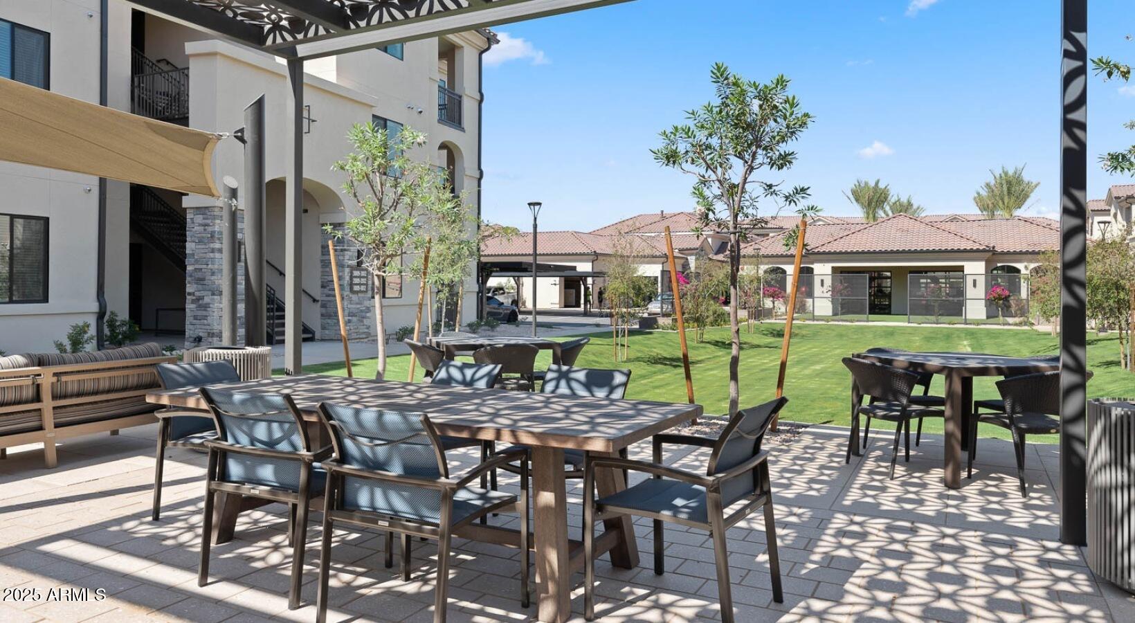 5885 South 32nd Street, Unit B2 Phoenix, AZ 85040 - Photo 31 of 33 a view of a dinning table and chairs in patio