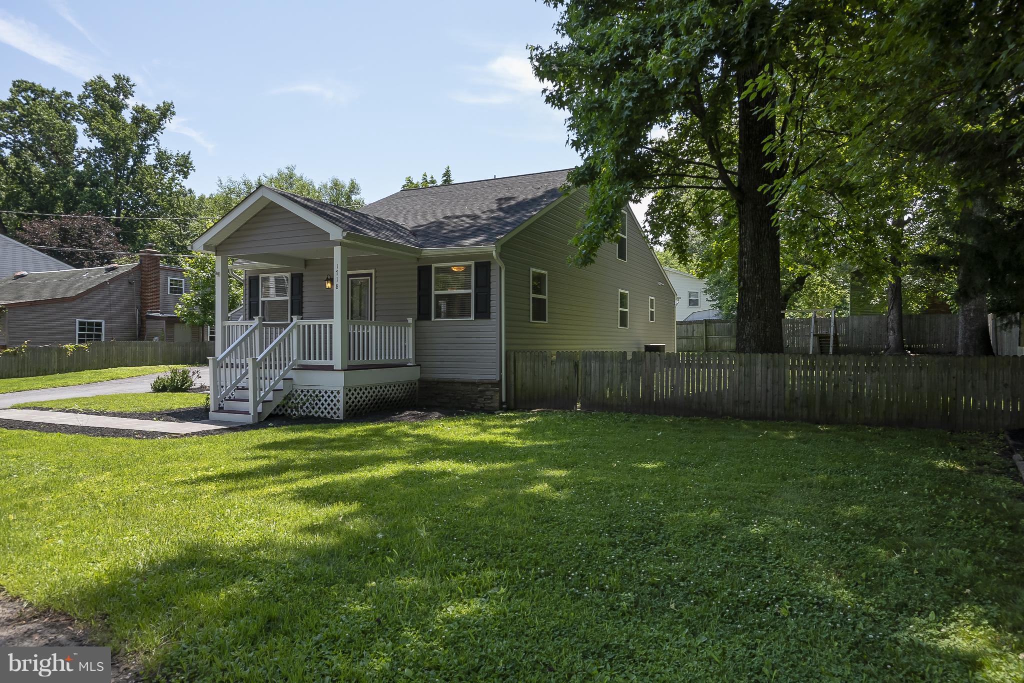 1718 Tacoma Road Edgewater, MD 21037 - Photo 2 of 30 a view of a house with a yard and a large tree