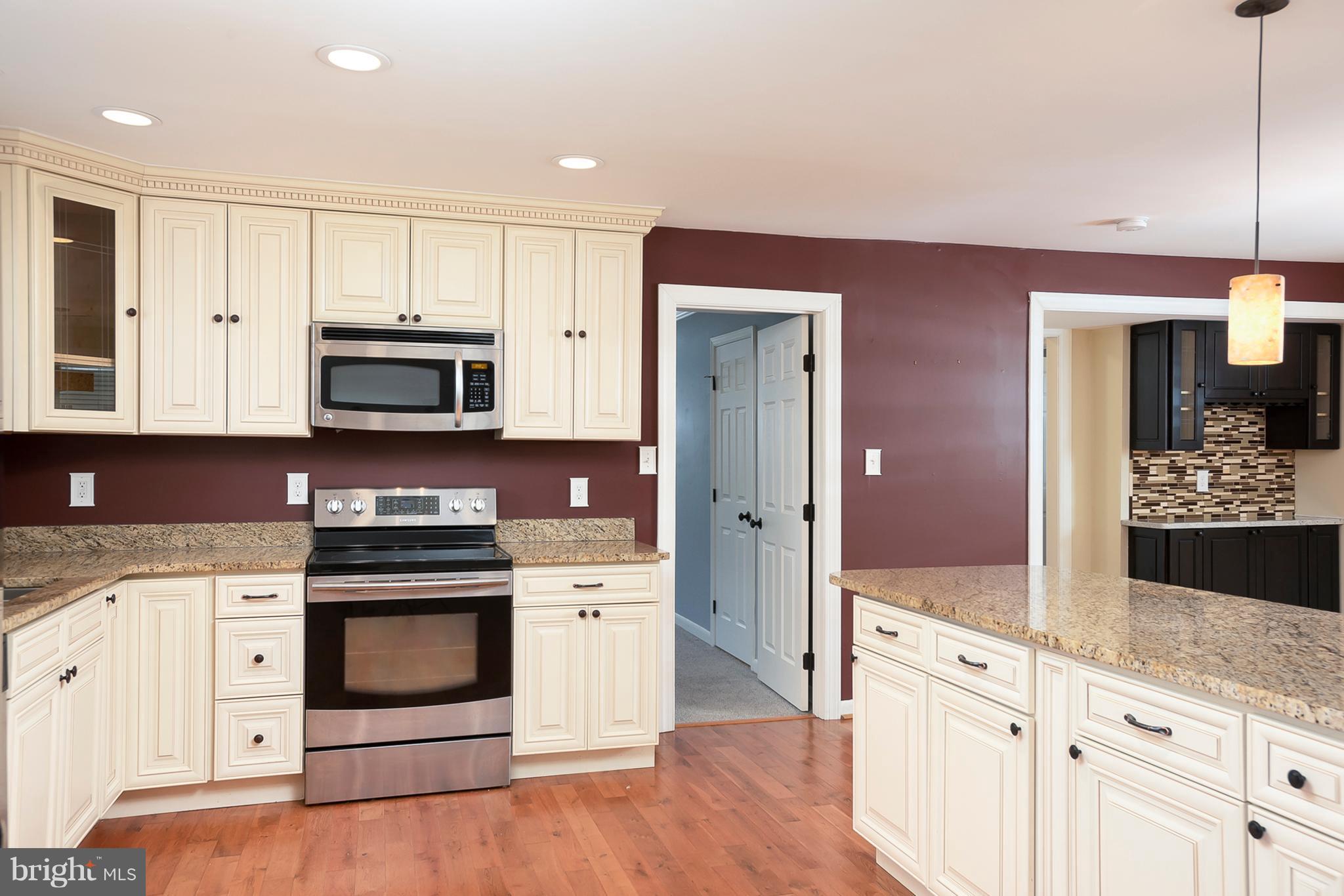 1718 Tacoma Road Edgewater, MD 21037 - Photo 14 of 30 a kitchen with stainless steel appliances granite countertop a stove a sink and a microwave