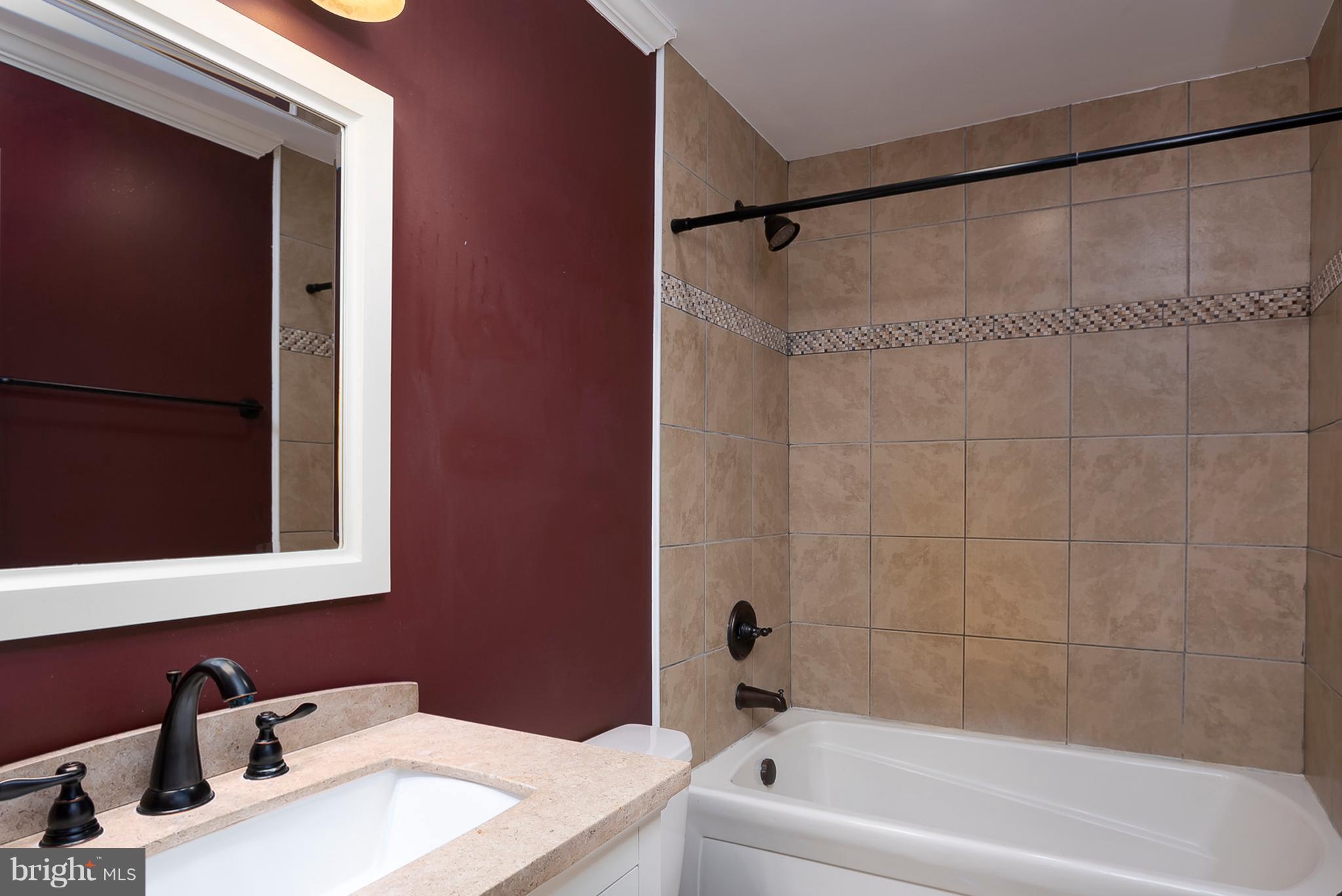 1718 Tacoma Road Edgewater, MD 21037 - Photo 16 of 30 a bathroom with a sink and a bathtub