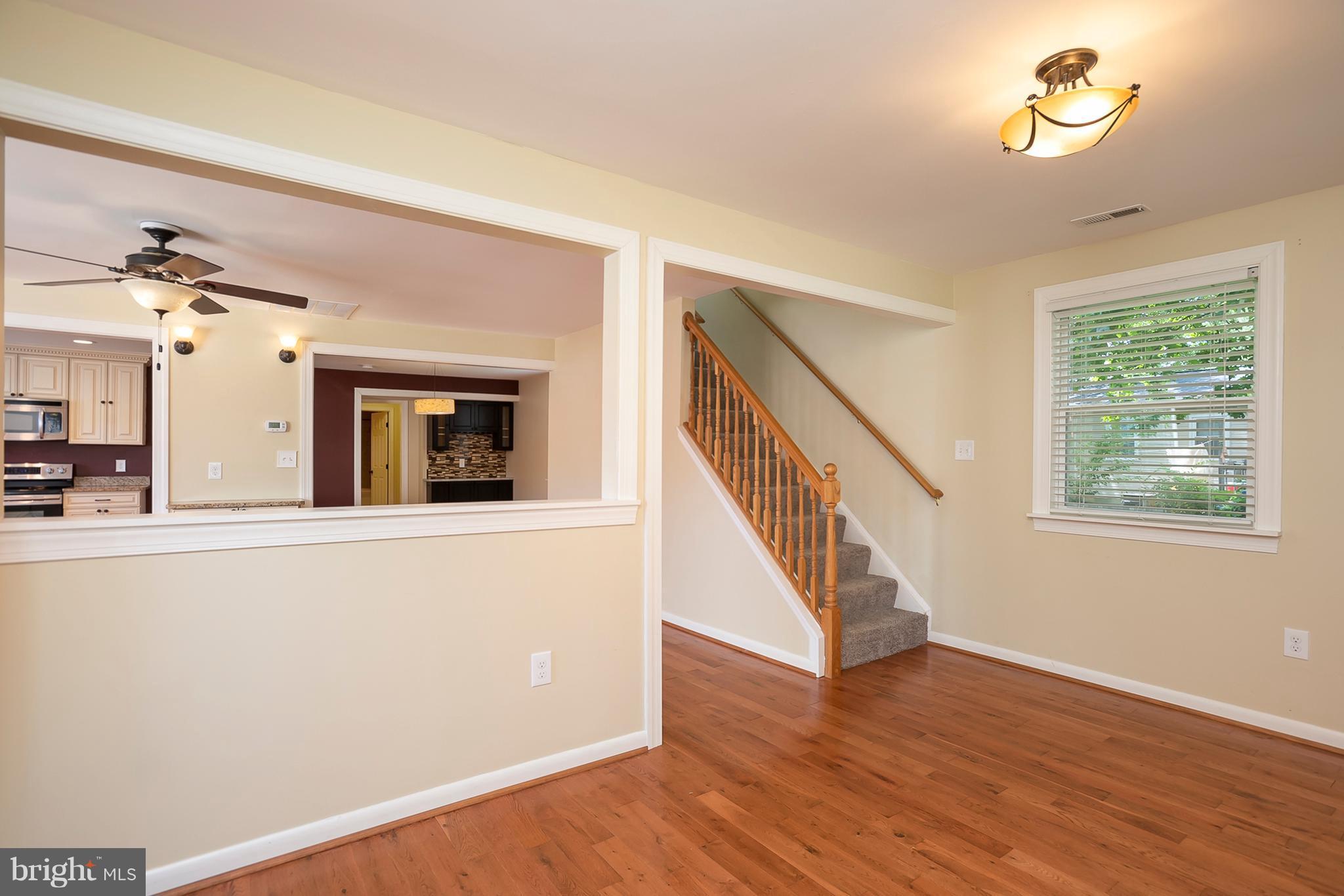 1718 Tacoma Road Edgewater, MD 21037 - Photo 6 of 30 wooden floor in an empty room with a window