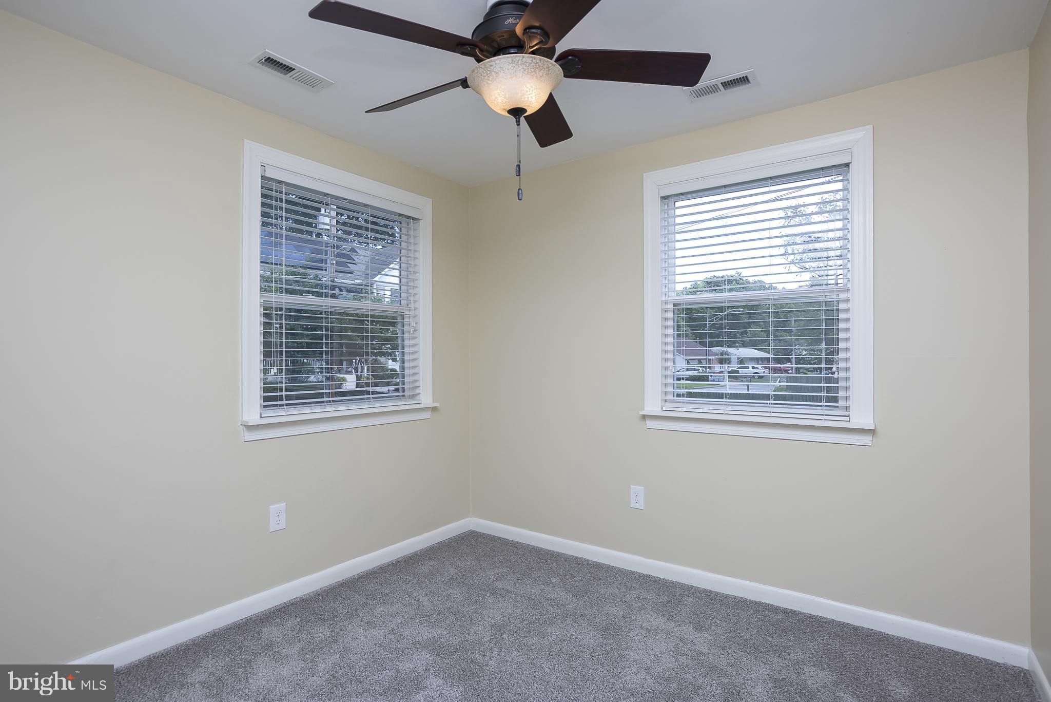 1718 Tacoma Road Edgewater, MD 21037 - Photo 8 of 30 an empty room with a window and a fan