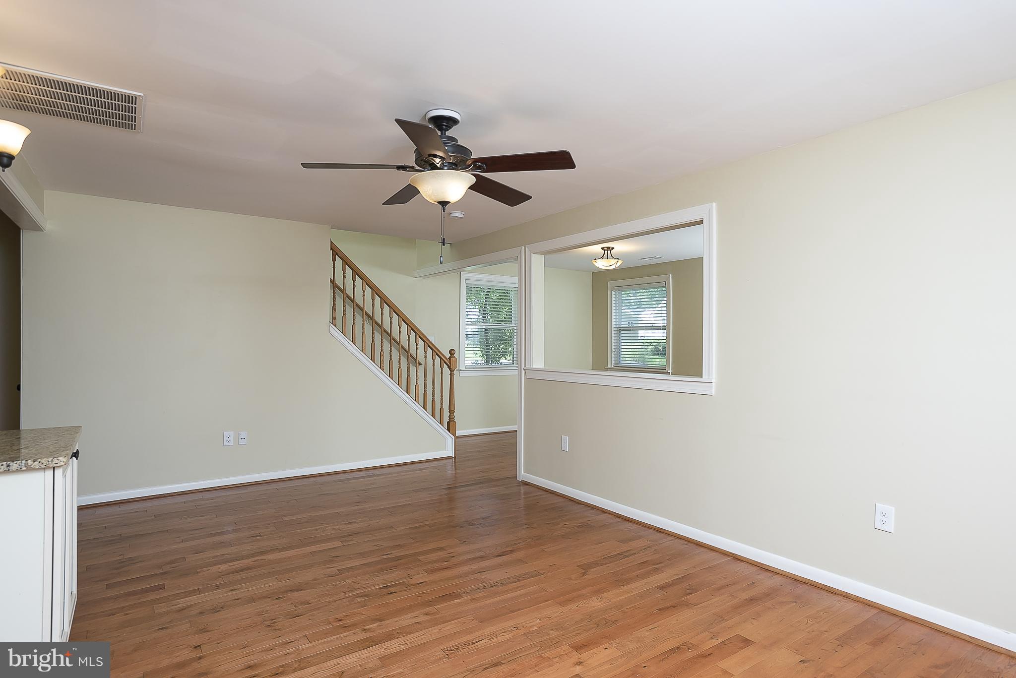 1718 Tacoma Road Edgewater, MD 21037 - Photo 10 of 30 a view of empty room with wooden floor and fan