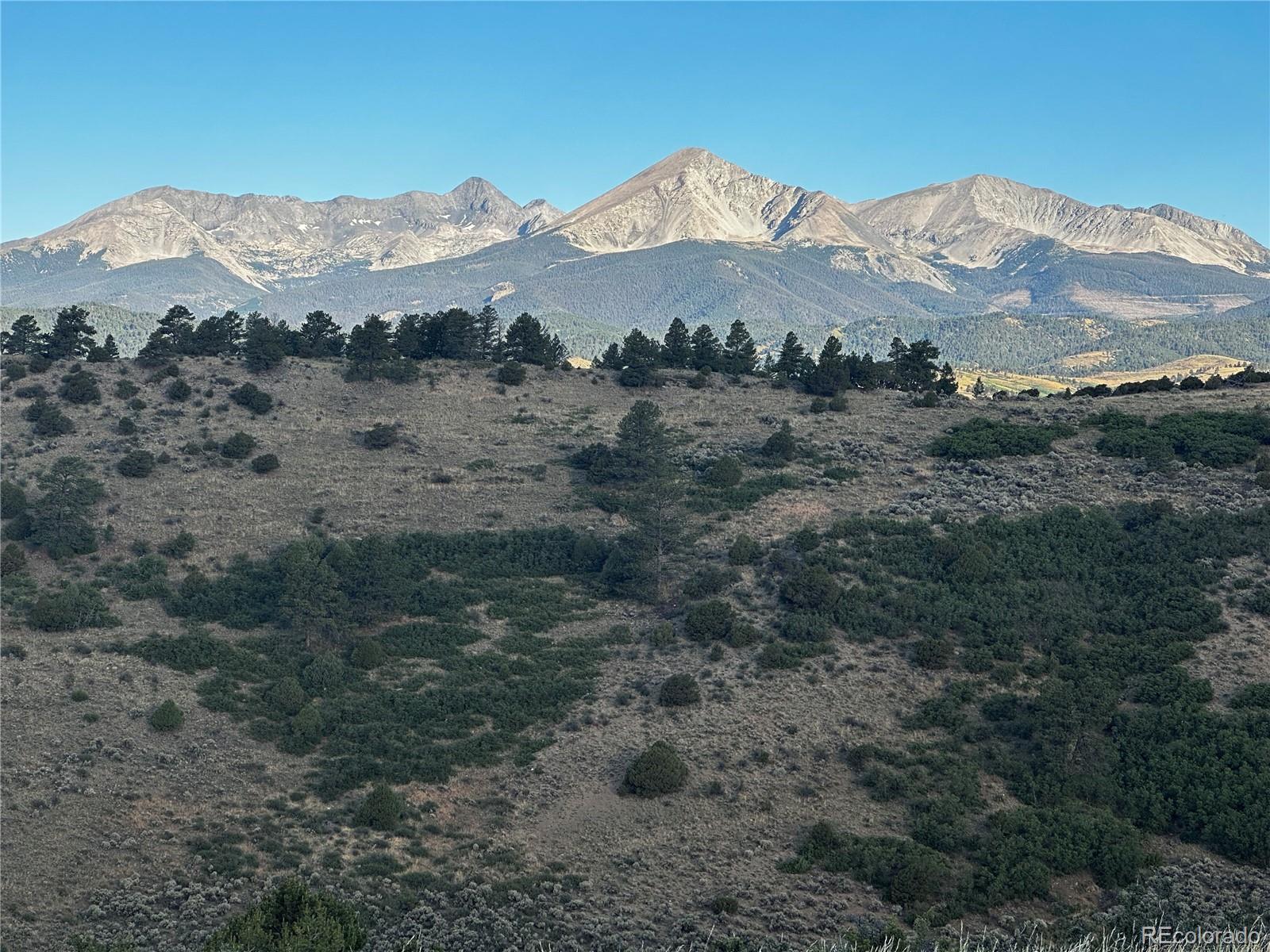 a view of a mountain with an ocean view