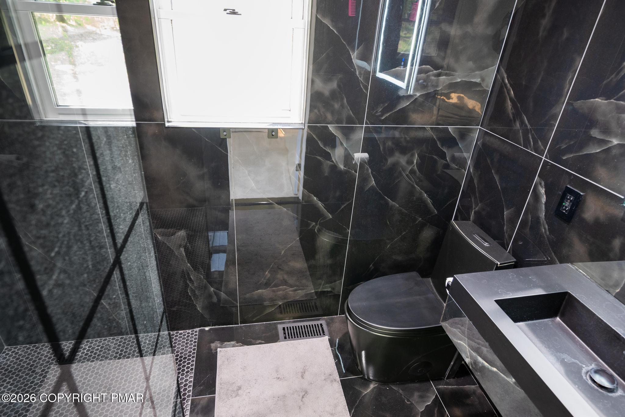 2312 Cramer Court Bushkill, PA 18324 - Photo 26 of 37 a bathroom with a toilet and a sink