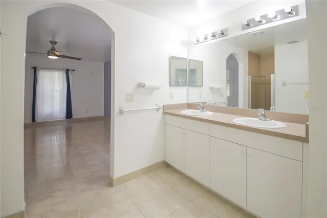 a spacious bathroom with a shower and a sink