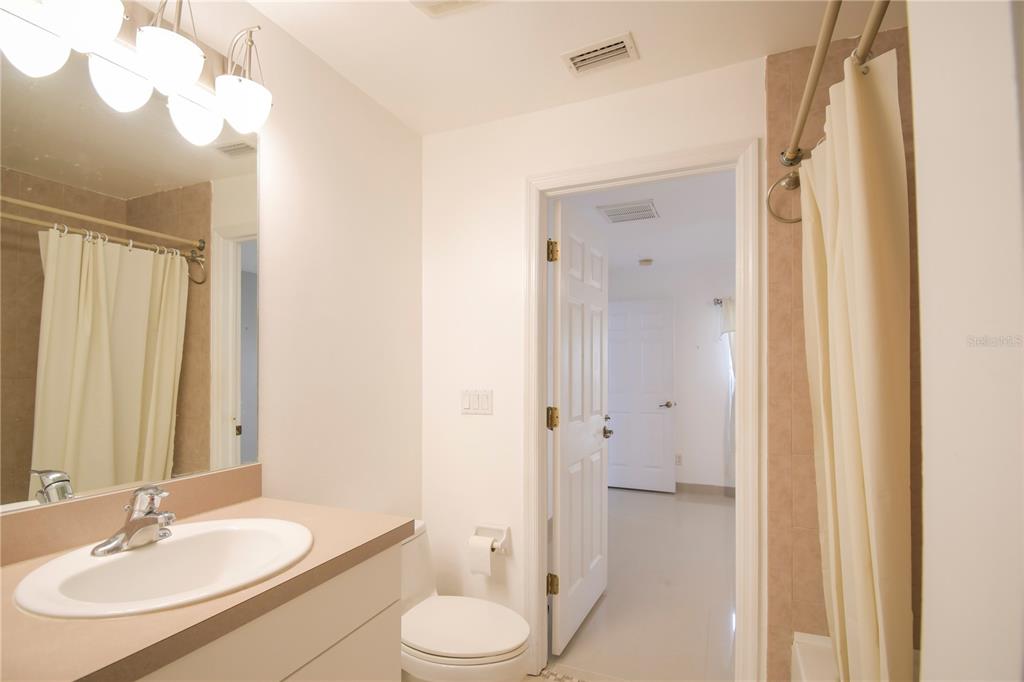 4913 Cromey Road North Port, FL 34288 - Photo 20 of 26 a bathroom with a sink a toilet and shower