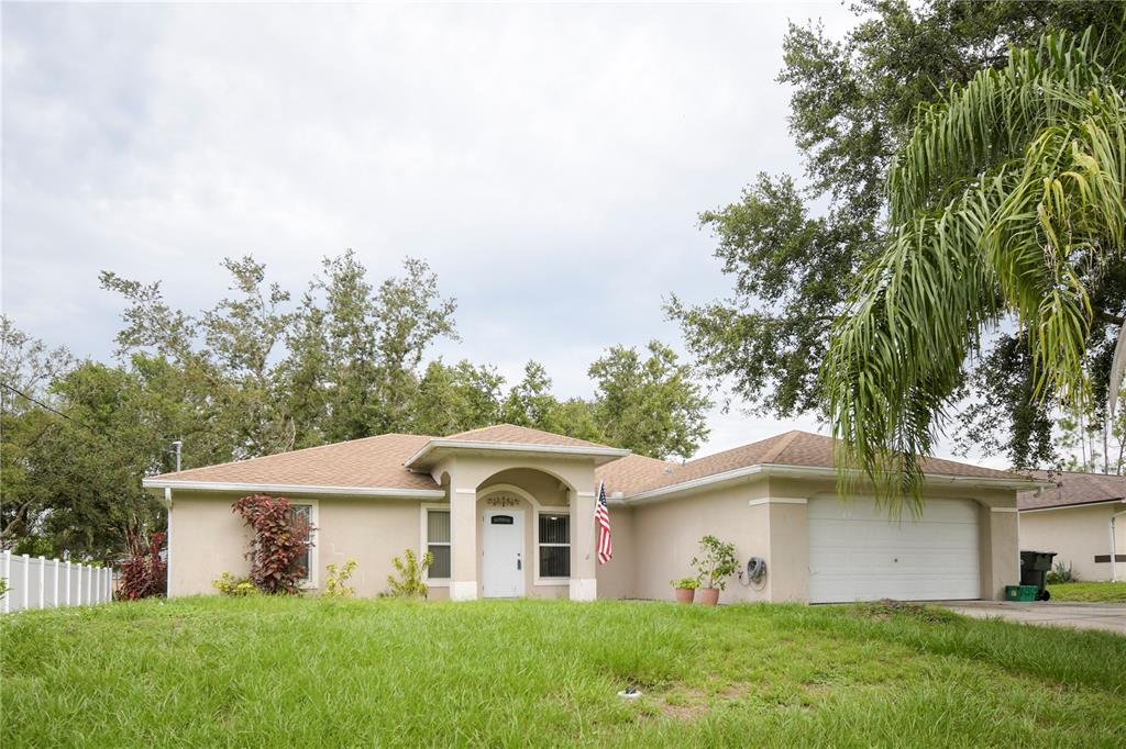 4913 Cromey Road North Port, FL 34288 - Photo 2 of 26 a front view of a house with garden