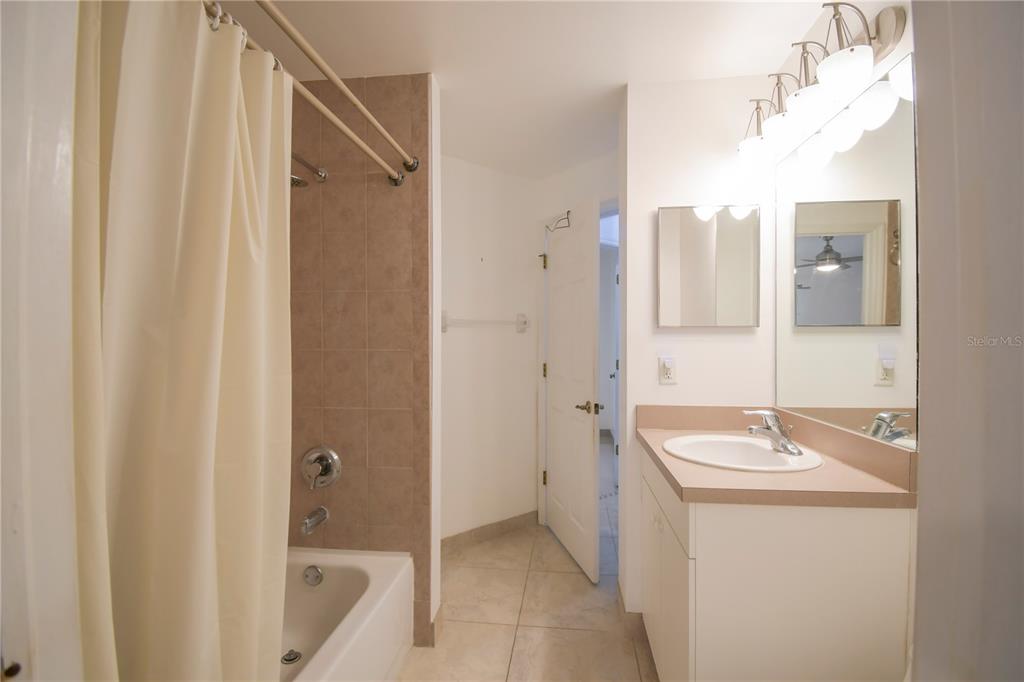 4913 Cromey Road North Port, FL 34288 - Photo 21 of 26 a bathroom with a sink a toilet and shower