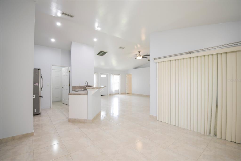 4913 Cromey Road North Port, FL 34288 - Photo 10 of 26 a view of a kitchen with refrigerator and microwave