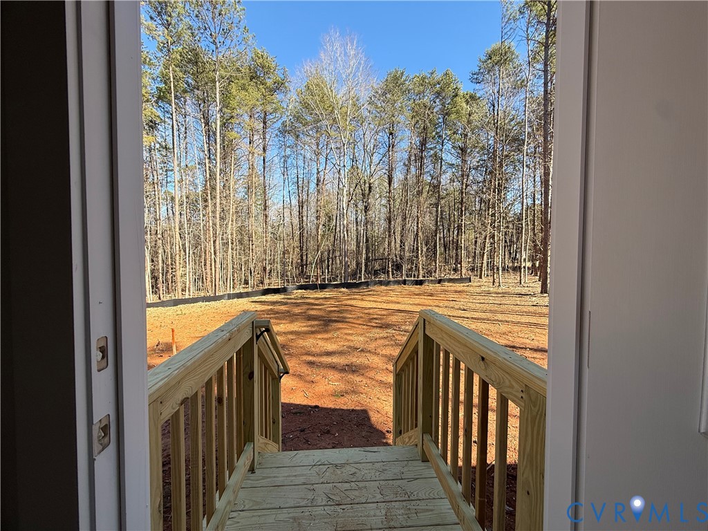 295 Merifield Drive Clarksville, VA 23927 - Photo 14 of 32 a view of a hallway with wooden floor and a balcony