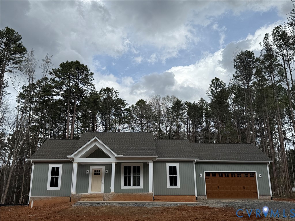 295 Merifield Drive Clarksville, VA 23927 - Photo 22 of 32 a front view of a house with a yard and garage