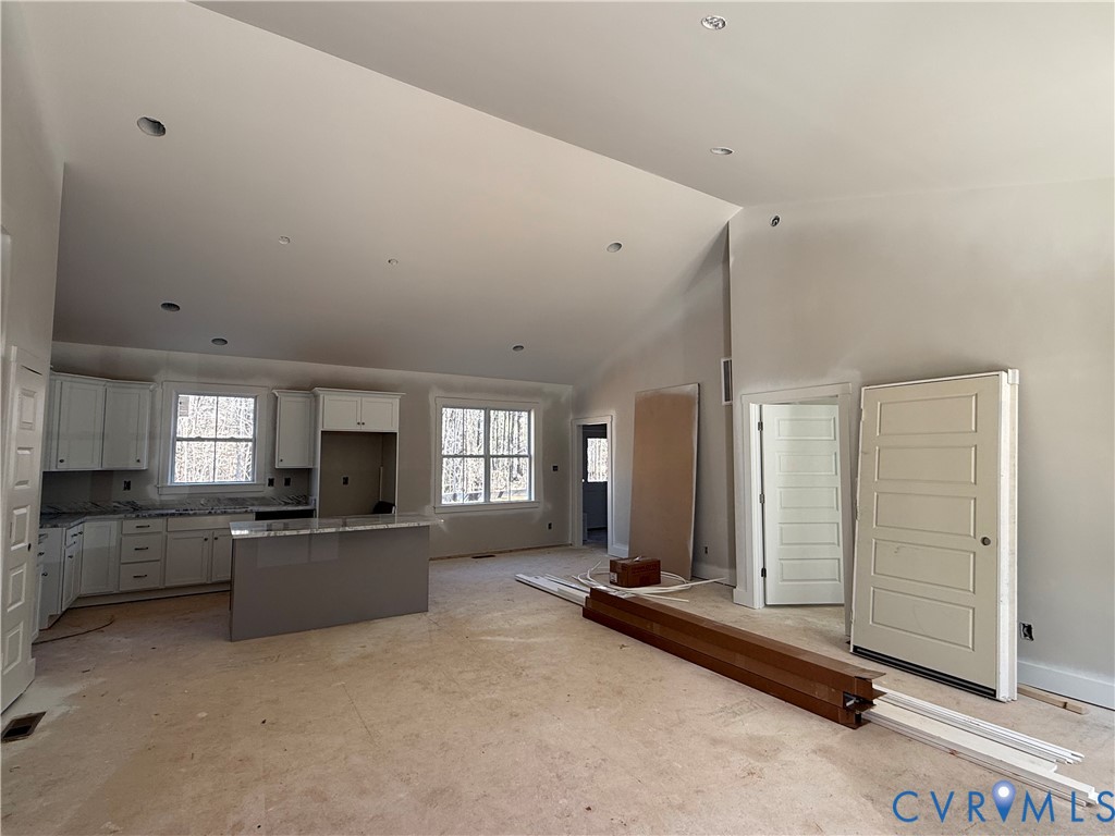 295 Merifield Drive Clarksville, VA 23927 - Photo 8 of 32 a large bedroom with a large window and furniture