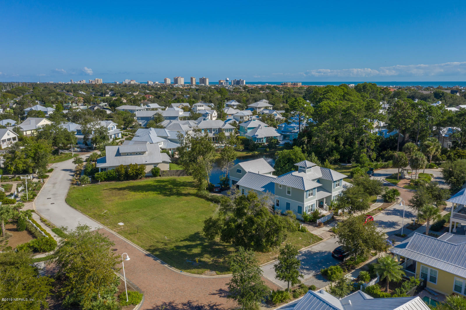 3743 Coconut Key Jacksonville Beach, FL 32250 - Photo 18 of 20 an aerial view of residential houses with outdoor space and trees