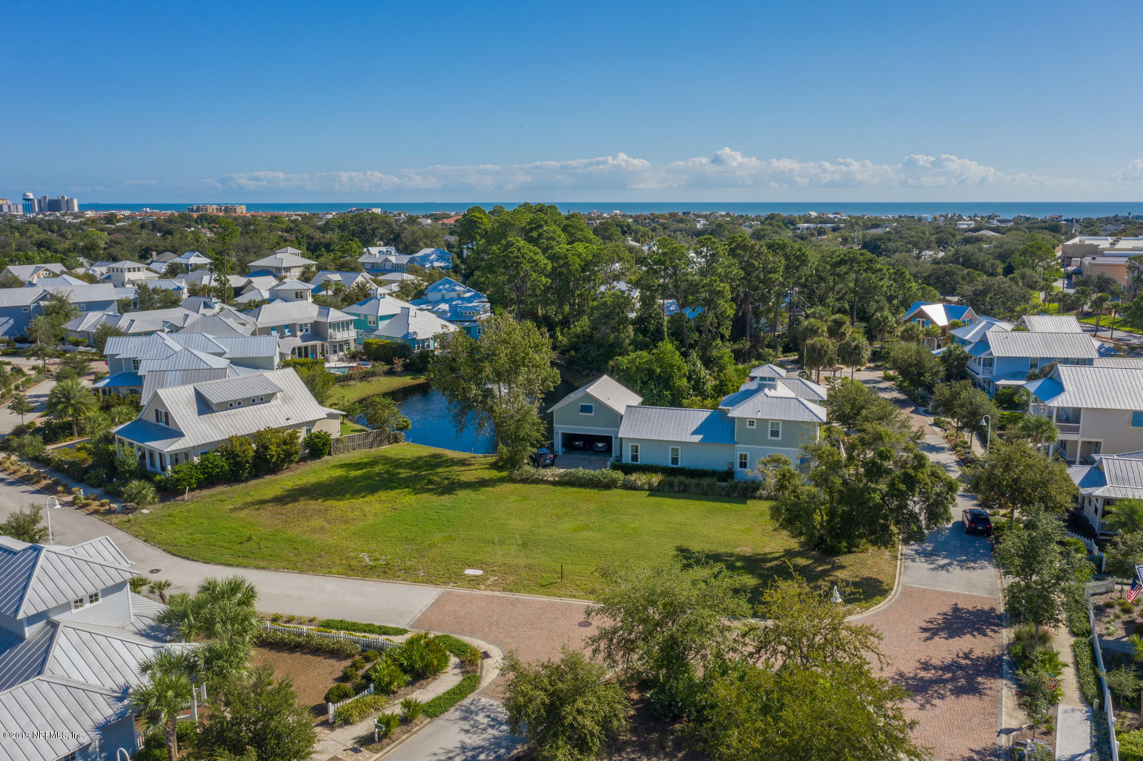 3743 Coconut Key Jacksonville Beach, FL 32250 - Photo 5 of 20 an aerial view of residential houses with outdoor space and trees