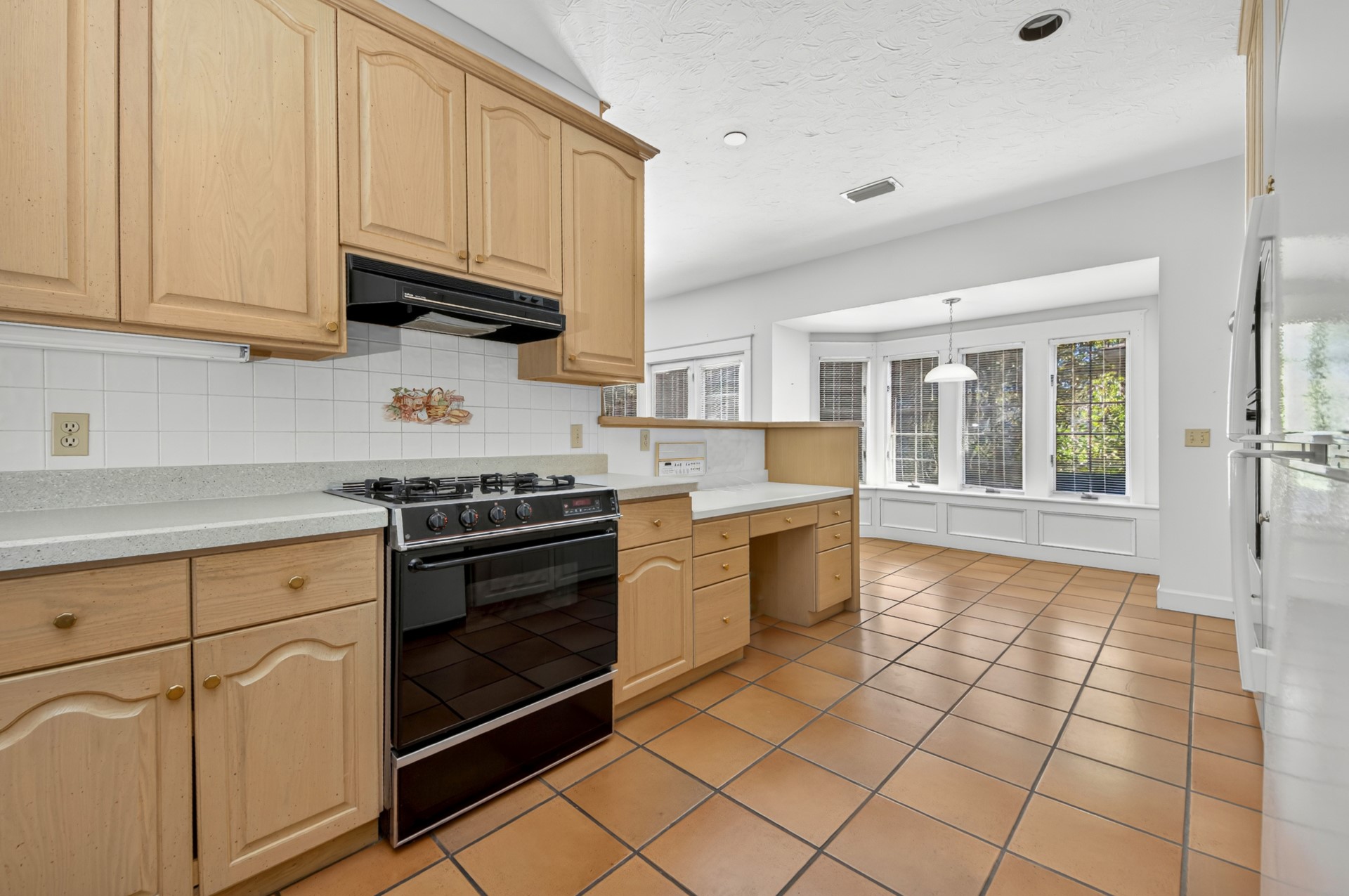 7 Hickory Lane Fernandina Beach, FL 32034 - Photo 11 of 42 a kitchen with stainless steel appliances granite countertop a stove a sink and a white cabinets